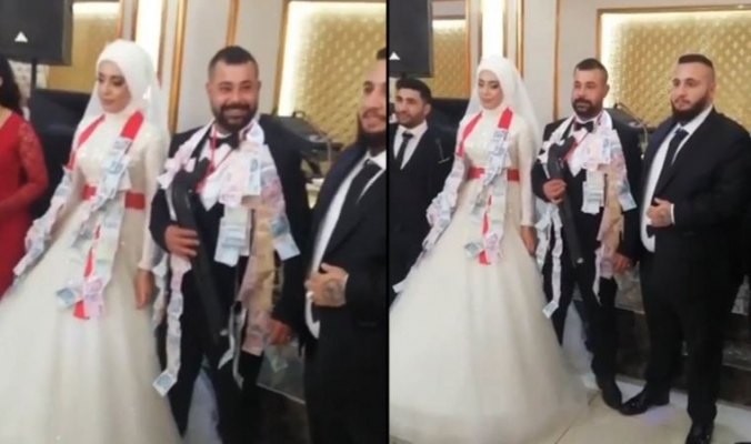 Damada kırmızı kurdele ile pompalı tüfek taktılar